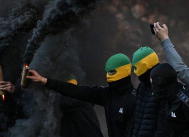 Chaos Erupts at French Football Match as Fans Storm Pitch