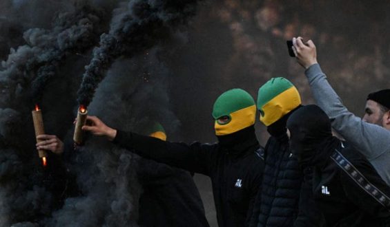 Chaos Erupts at French Football Match as Fans Storm Pitch