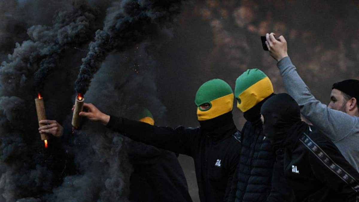 Chaos Erupts at French Football Match as Fans Storm Pitch