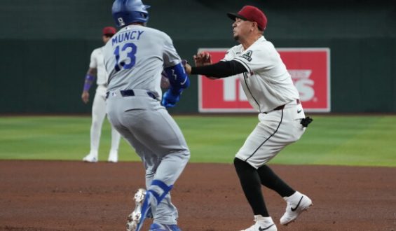 Dramatic Collision on the Field: Vargas and Muncy Injured in Baseball Game