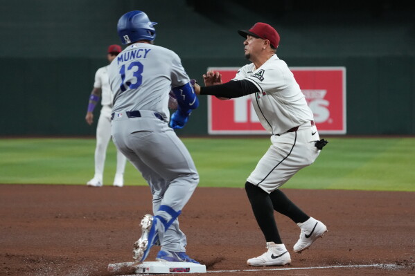 Dramatic Collision on the Field: Vargas and Muncy Injured in Baseball Game