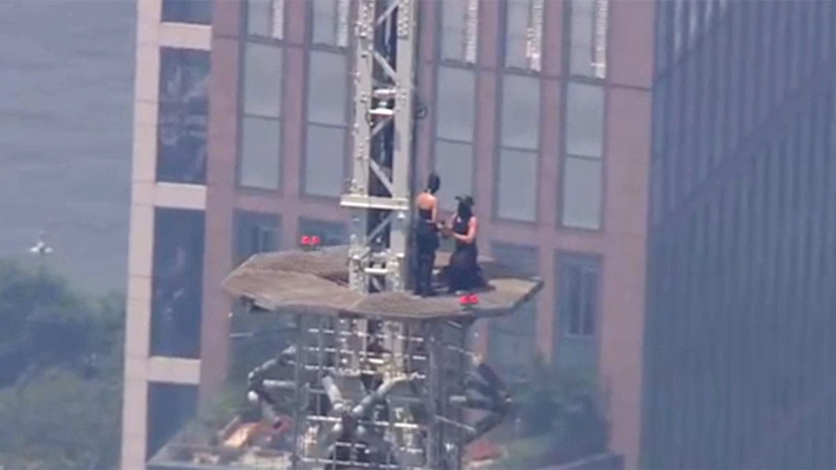 Proposal Stunt on Empire State Building Spire