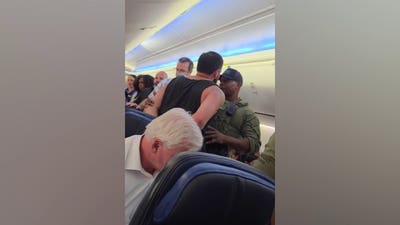 Video Shows Police Escort Unruly Passenger Off United Flight
