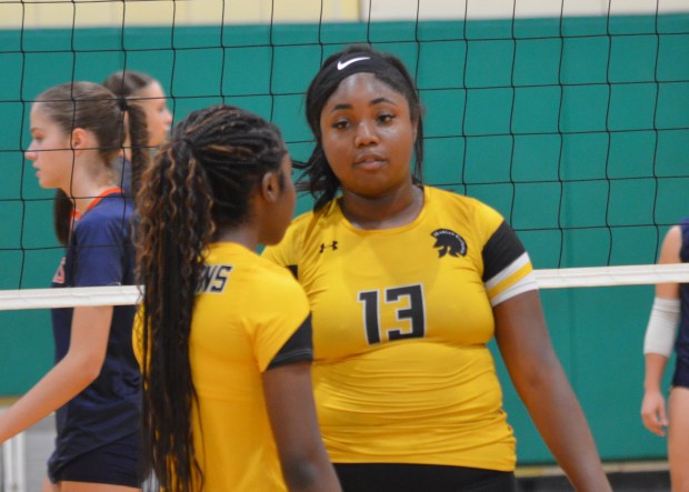 Marian Catholic and St. Laurence Volleyball Teams Face Challenges and Triumphs