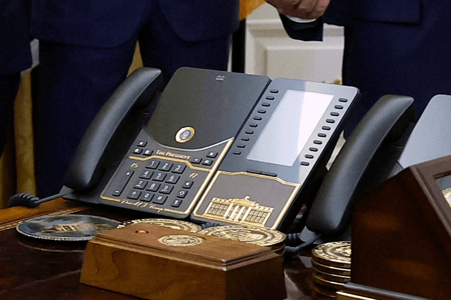 Trump Unveils Customized Gold Desk Phone in Oval Office